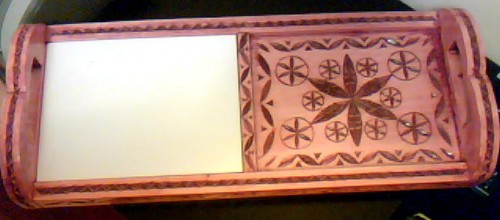 chipcarved cheese and cracker tray of basswood, overall size 18" x 7.5" x 2.75", tile cutting surface 6" x 8", golden mahogany stain