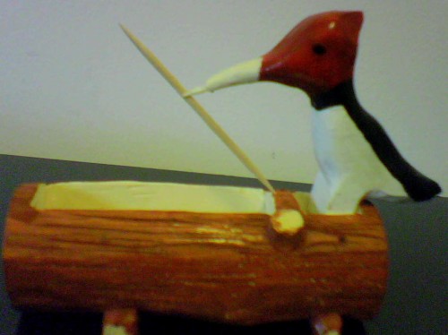 wood pecker pickes up a tooth pick, basswood painted and finished with lacker.