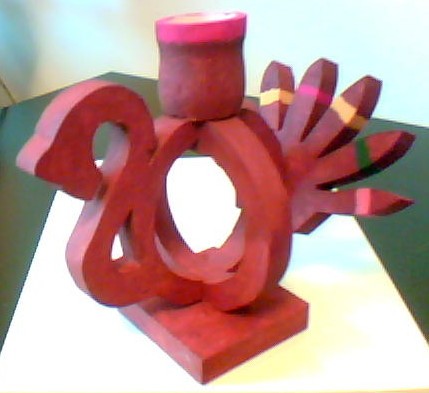 Scroll sawed,painted,oak
candle holder. 3" wide-4 1/2" high-5 1/2" long