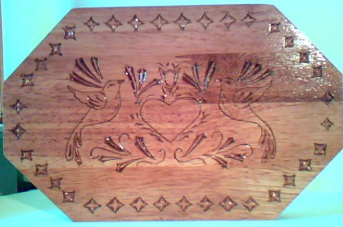 hard wood finished with butcher block finish.
6 1/2x10 1/2 hand carved
Food safe.