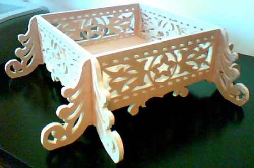 scroll sawed 1/4in birch plywood,natural finish.overall size 11 1/2" by 11 1/2"